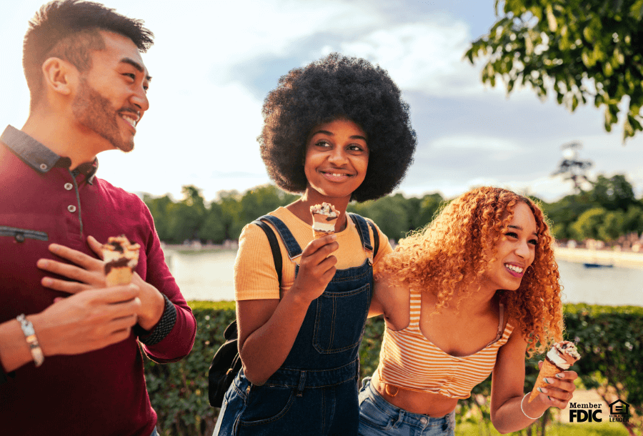 A group of new college students eat ice cream together.
