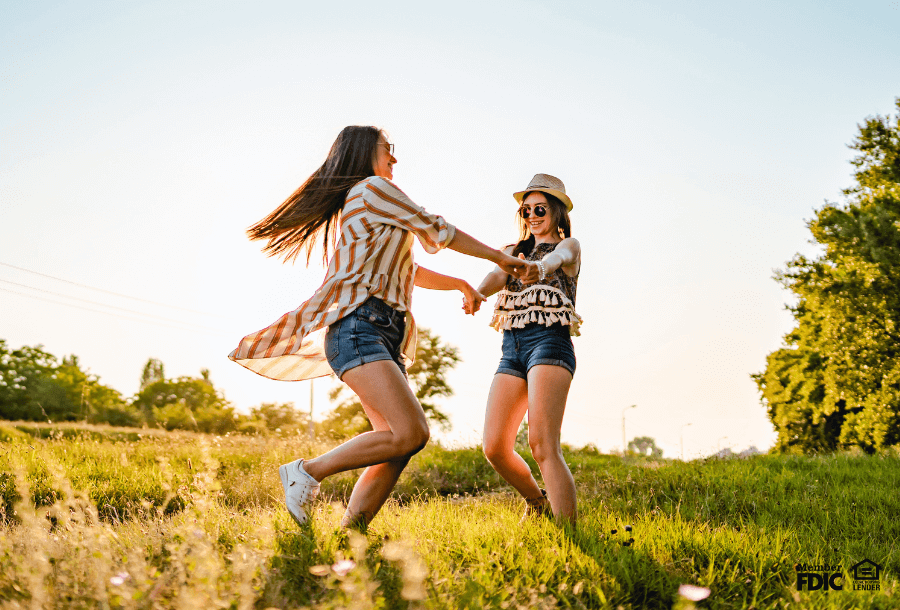 Two women celebrate revolving credit.