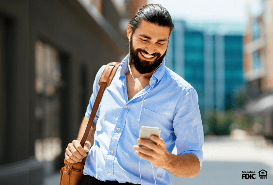 A man checks his credit score through his mobile banking ap.