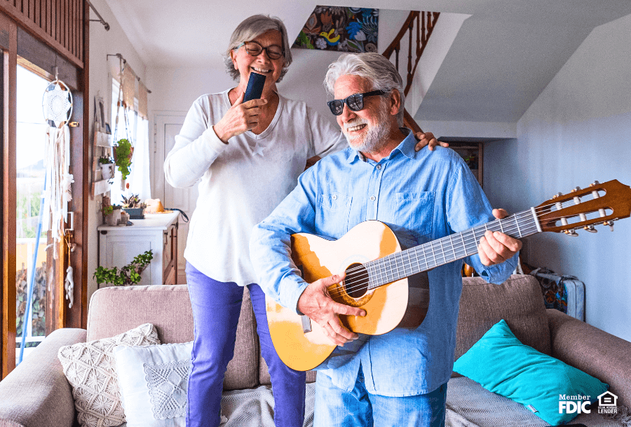 two homeowners celebrate after refinancing their home