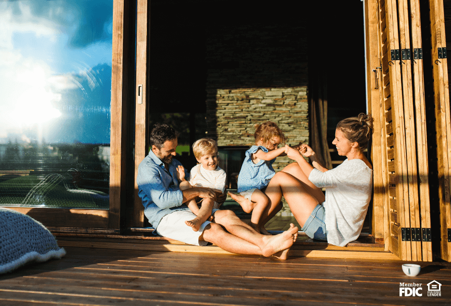 a family enjoys the new deck they funded with a HELCO